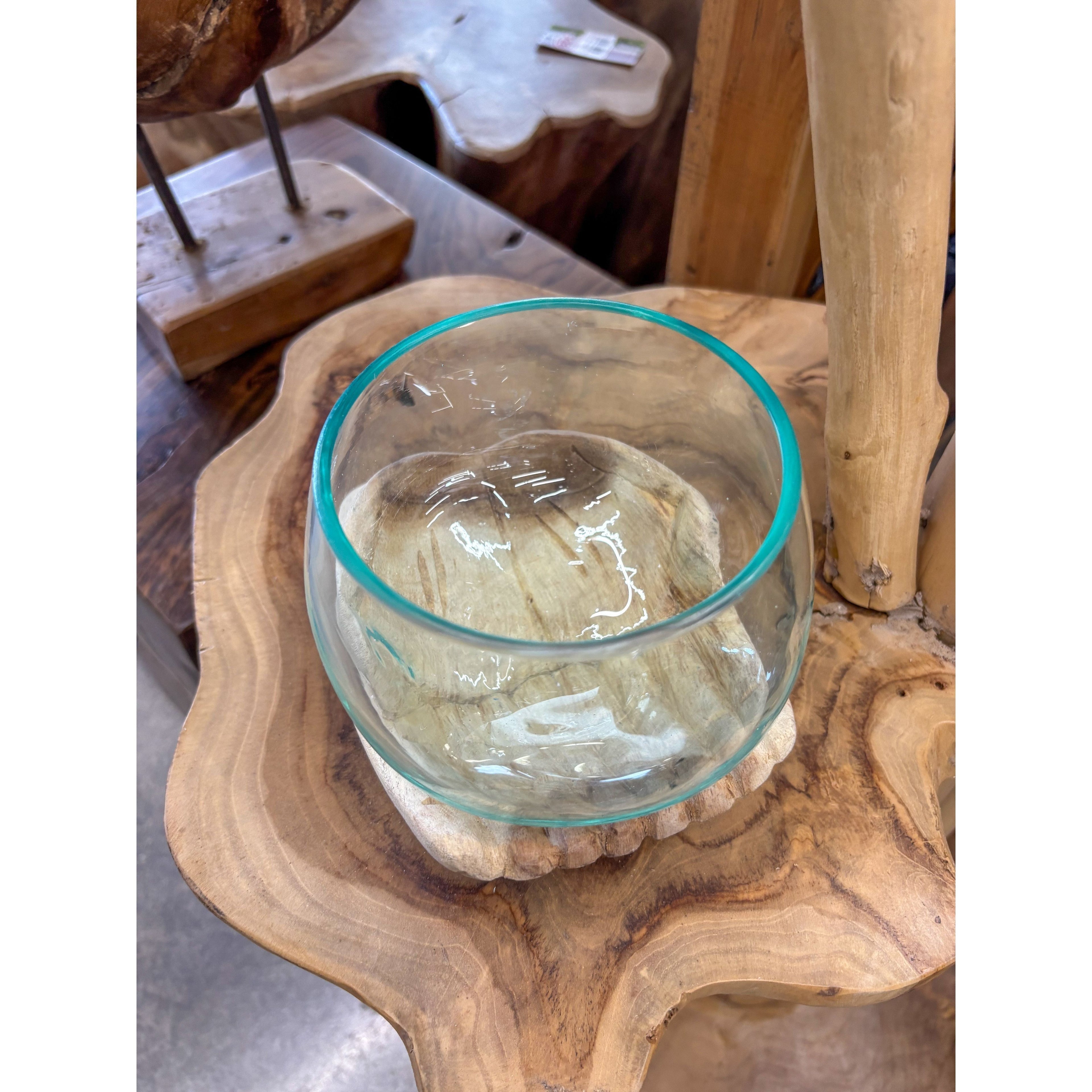 Wood hands with blown glass Broward Design Center