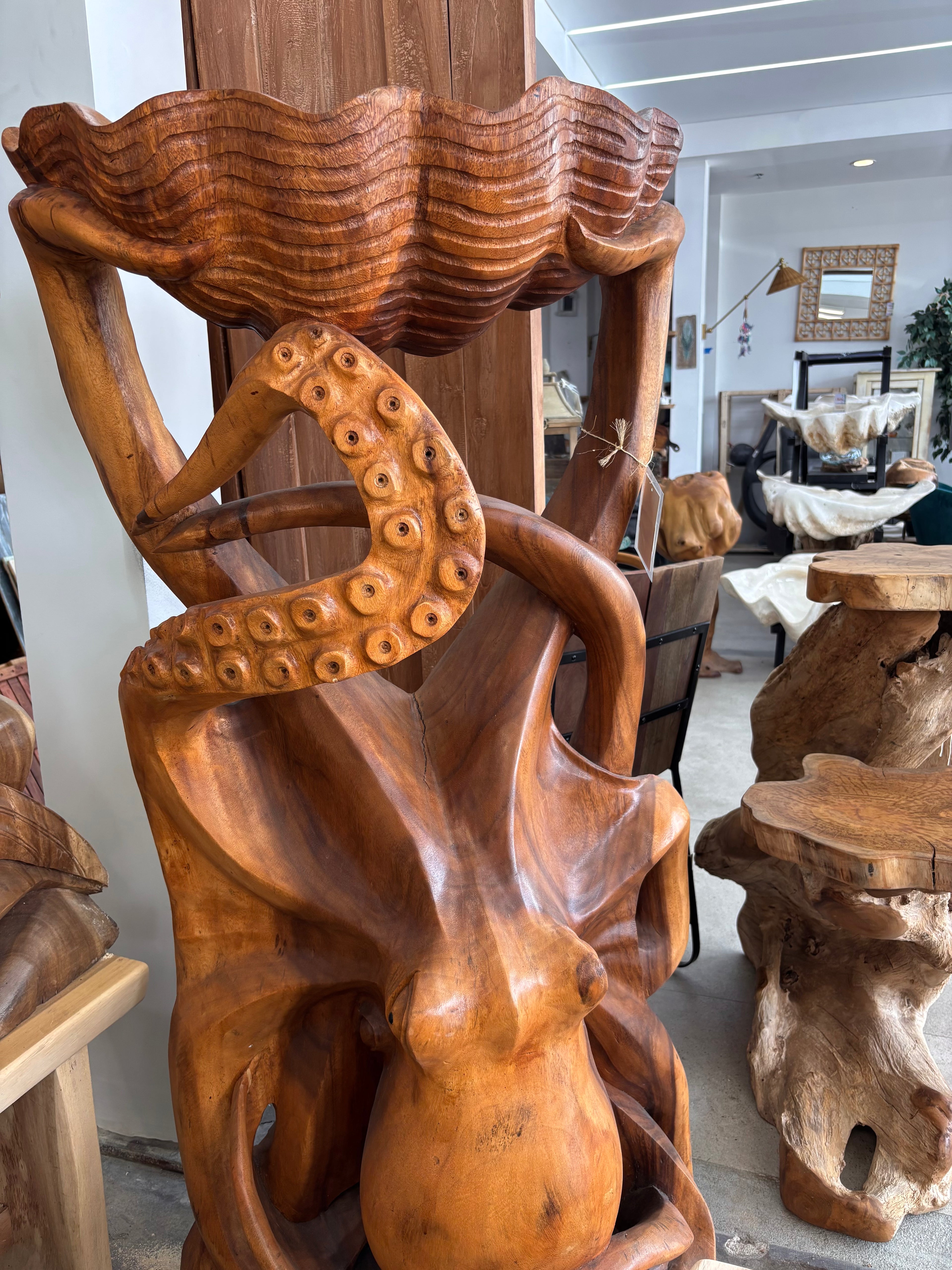 Suar Octopus Sculpture Holding Shell Broward Design Center