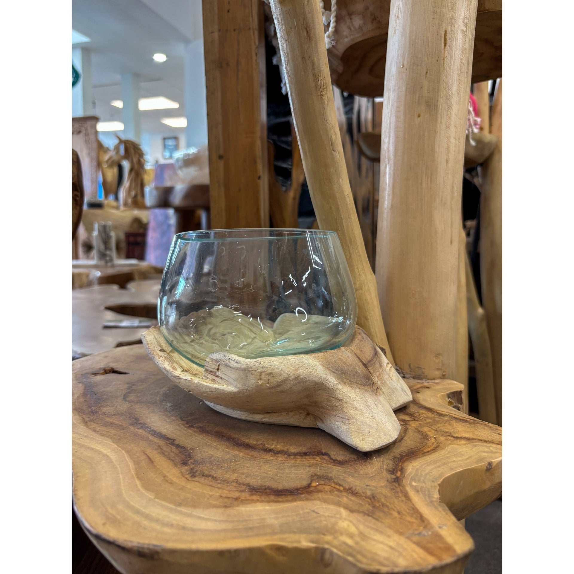 Wood hands with blown glass Broward Design Center
