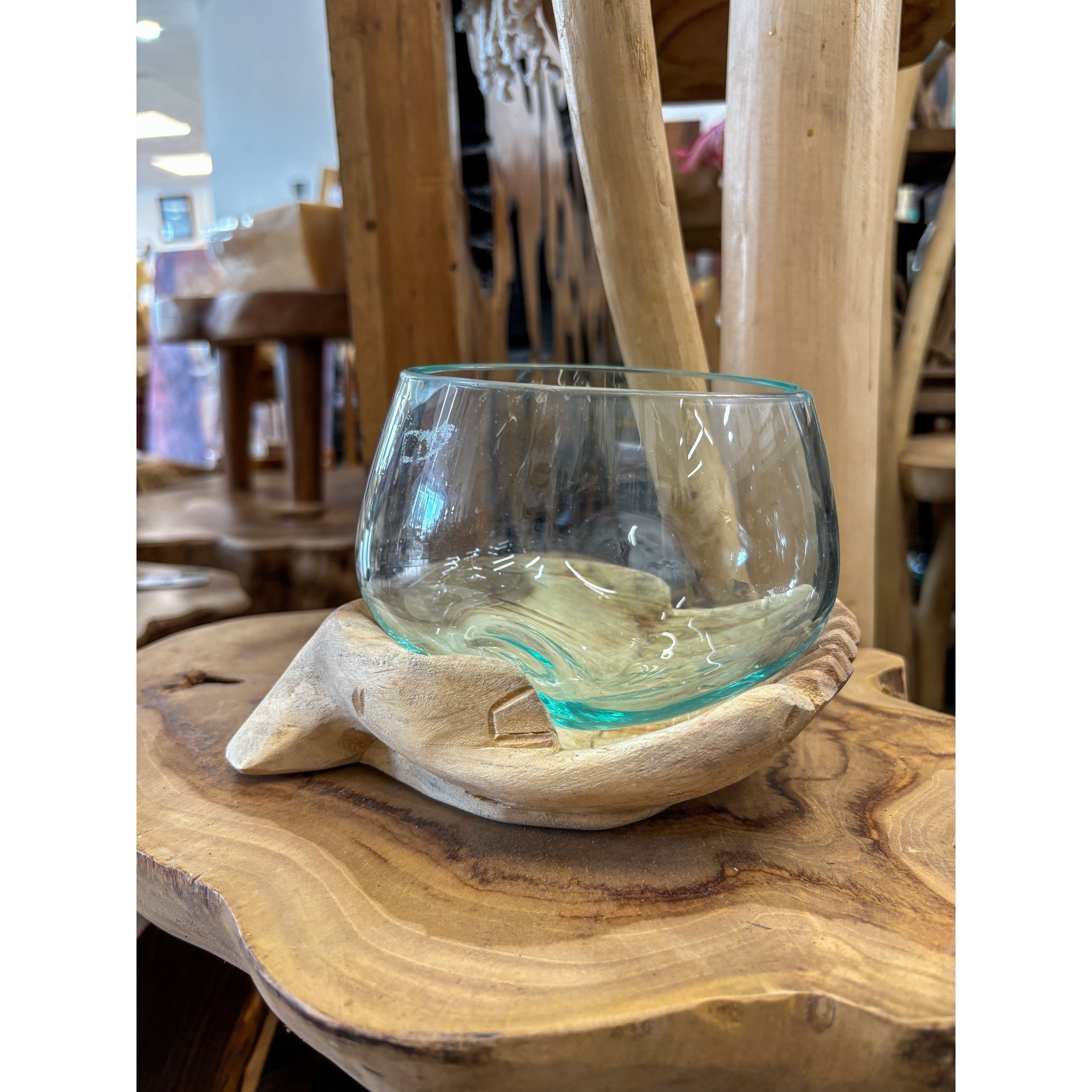 Wood hands with blown glass Broward Design Center